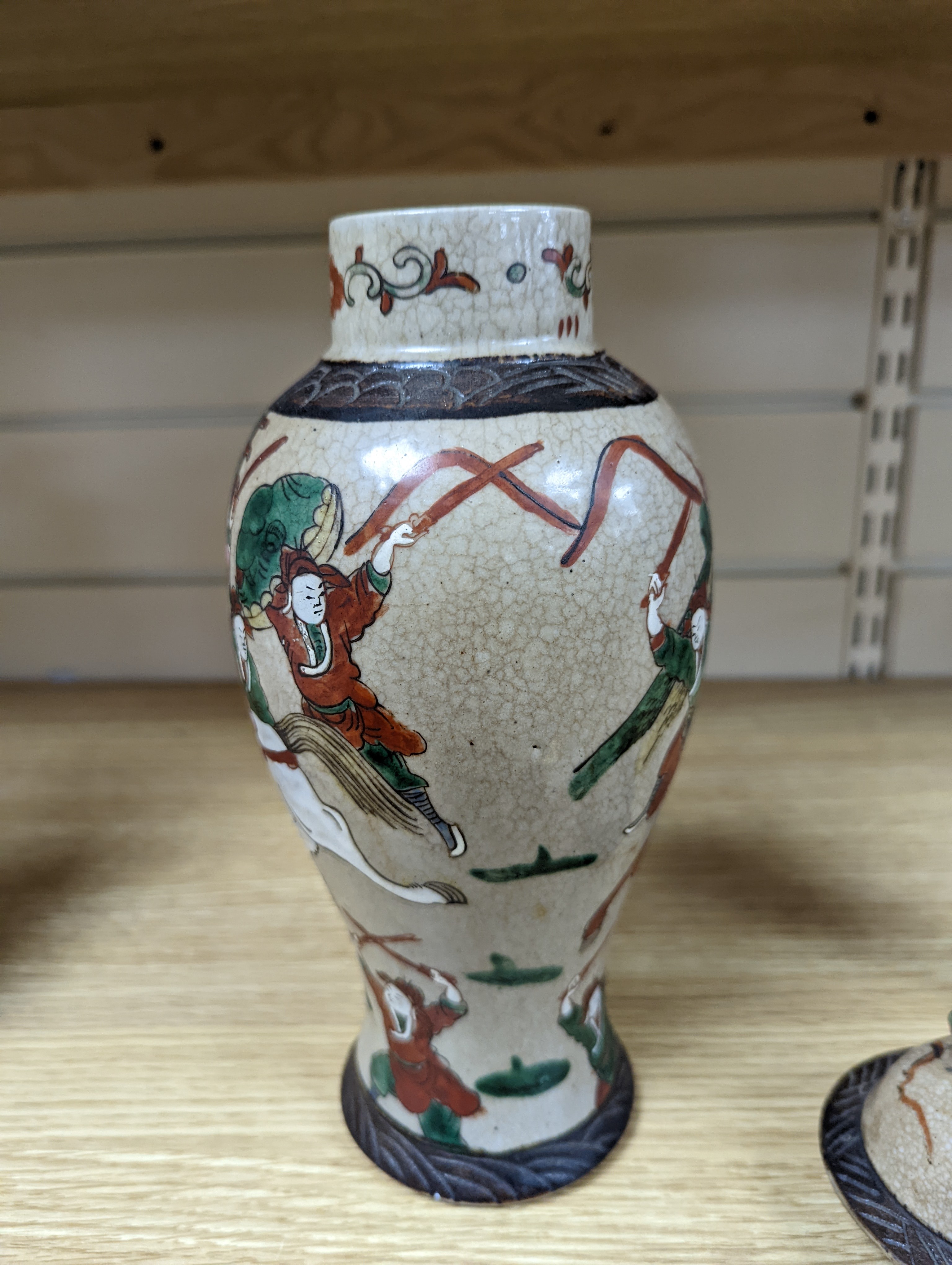 A late 19th century Chinese crackle glaze famille rose baluster vase and cover 30cm